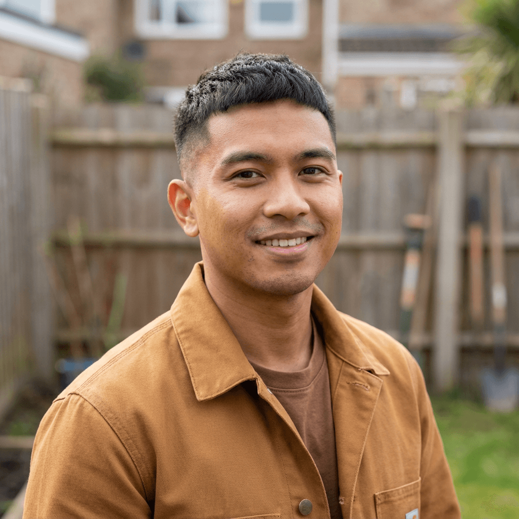 male homeowner in his mid 30s with relieved expression at home